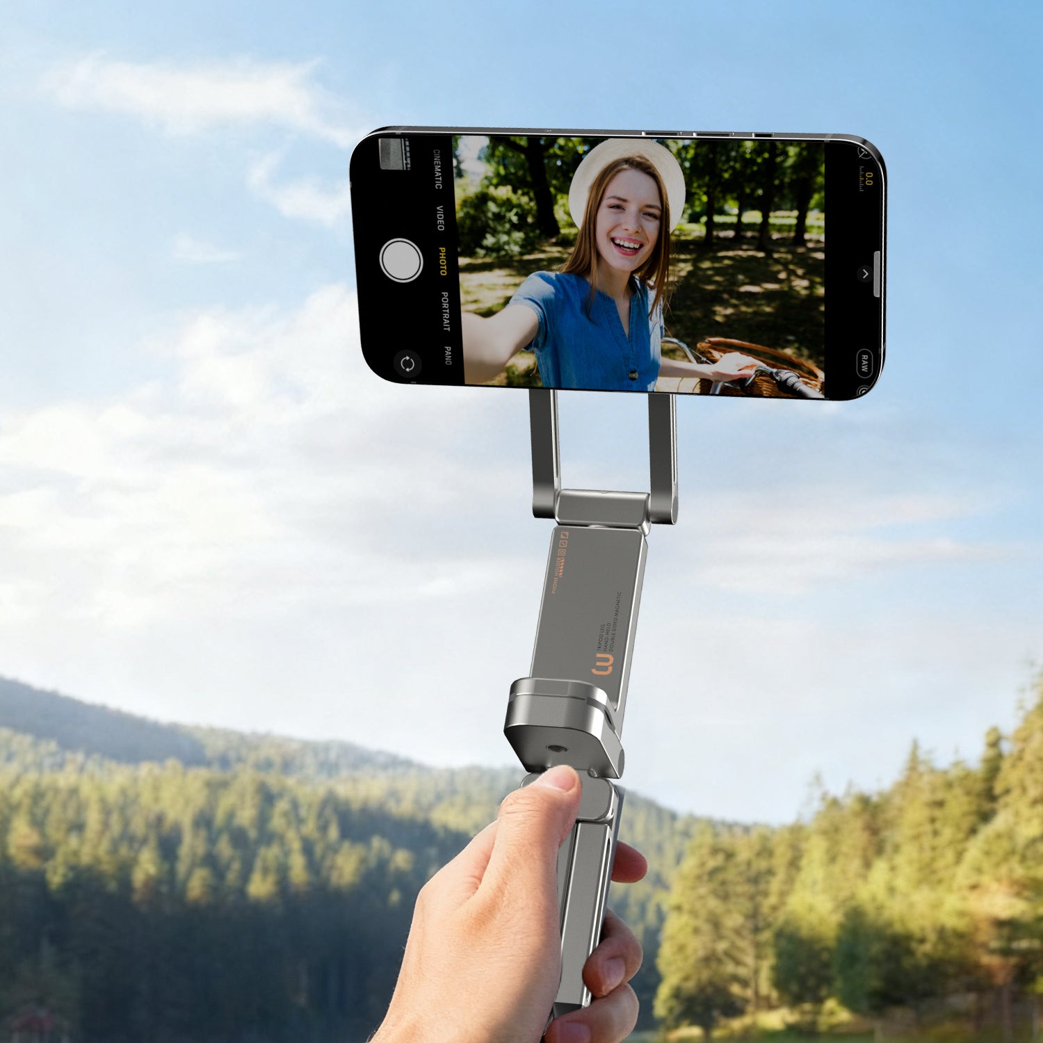 Handheld MagSafe tripod capturing outdoor vlog with smartphone.